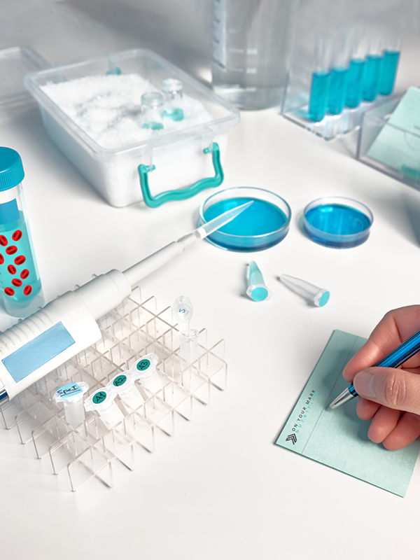 Lab technician recording test results for the Masterjohn-Schilling Advanced Spike Panel.